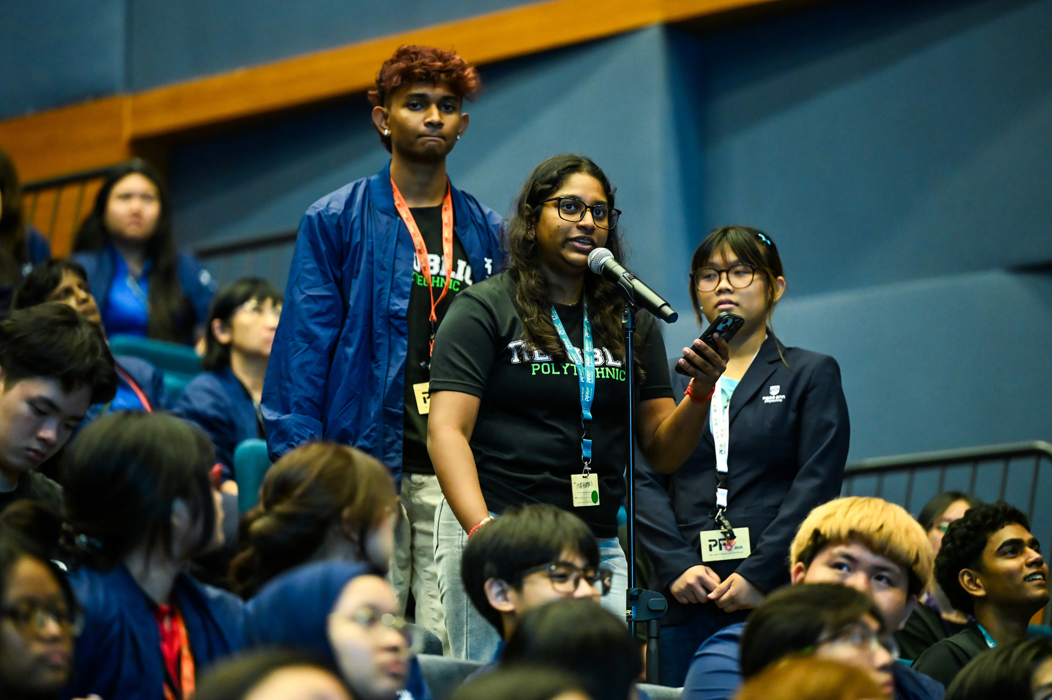 Student delegate posing a question during the panel dialogue session with Minister Mr David Neo.